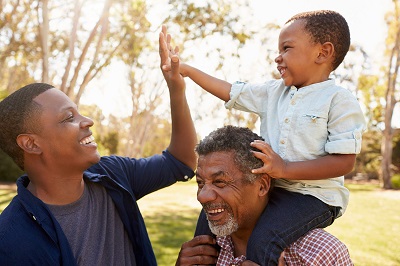 grandfather, son and grandson having fun