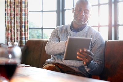 senior man with tablet