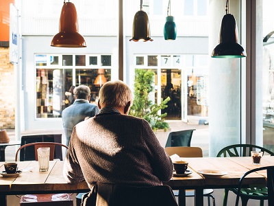 man at cafe; photo by Jeff Sheldon on Unsplash